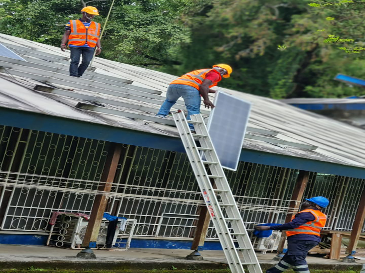 fintrustafrica-solar-panels-with-men-working-on-rough-reduced-01.jpeg